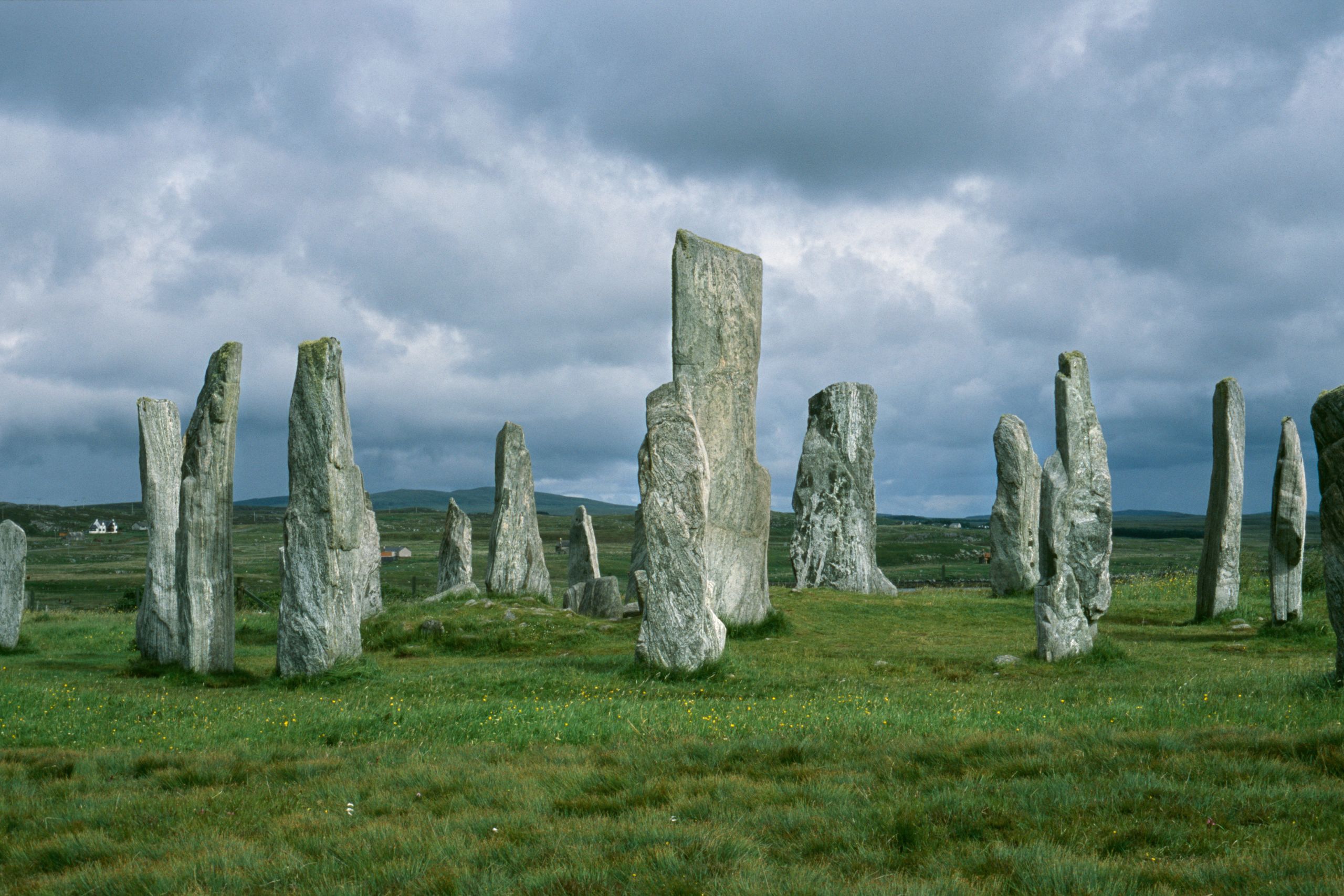 Majestic stone circle standing tall under a cloudy sky, showcasing ancient history and mystery.